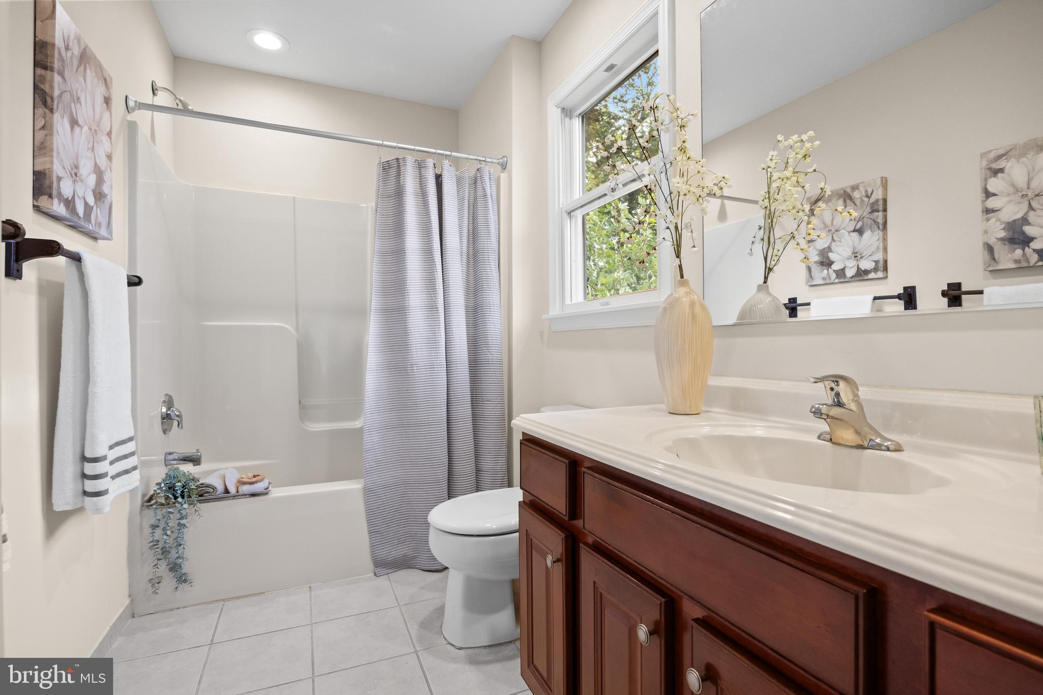 310 South Washington Avenue Moorestown, NJ 08057 - Photo 25 of 37 a bathroom with a sink a toilet a mirror a vanity and shower