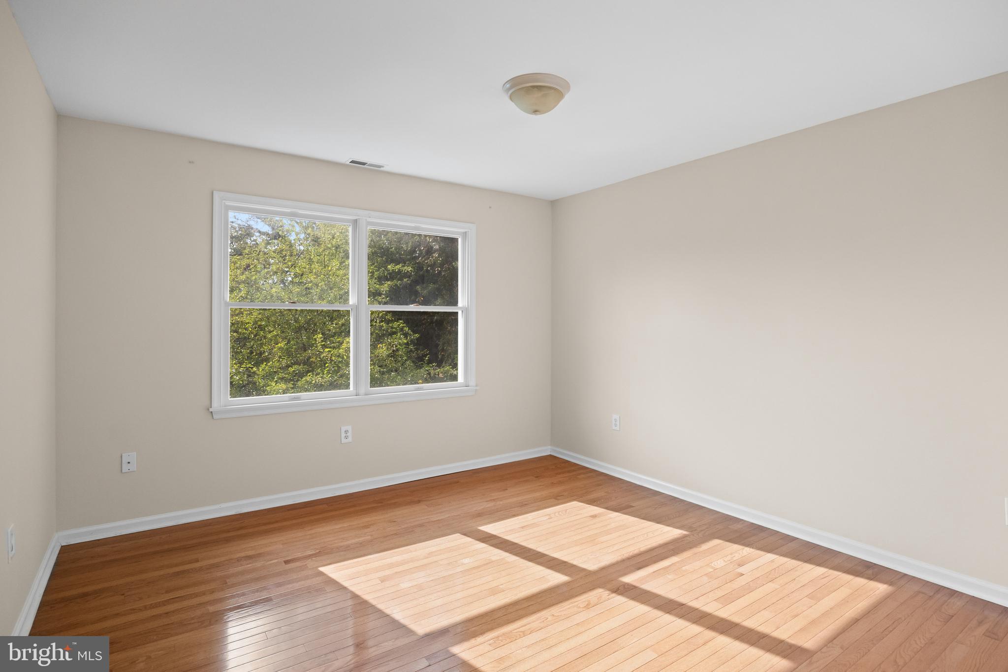 310 South Washington Avenue Moorestown, NJ 08057 - Photo 28 of 37 a view of an empty room with wooden floor and a window