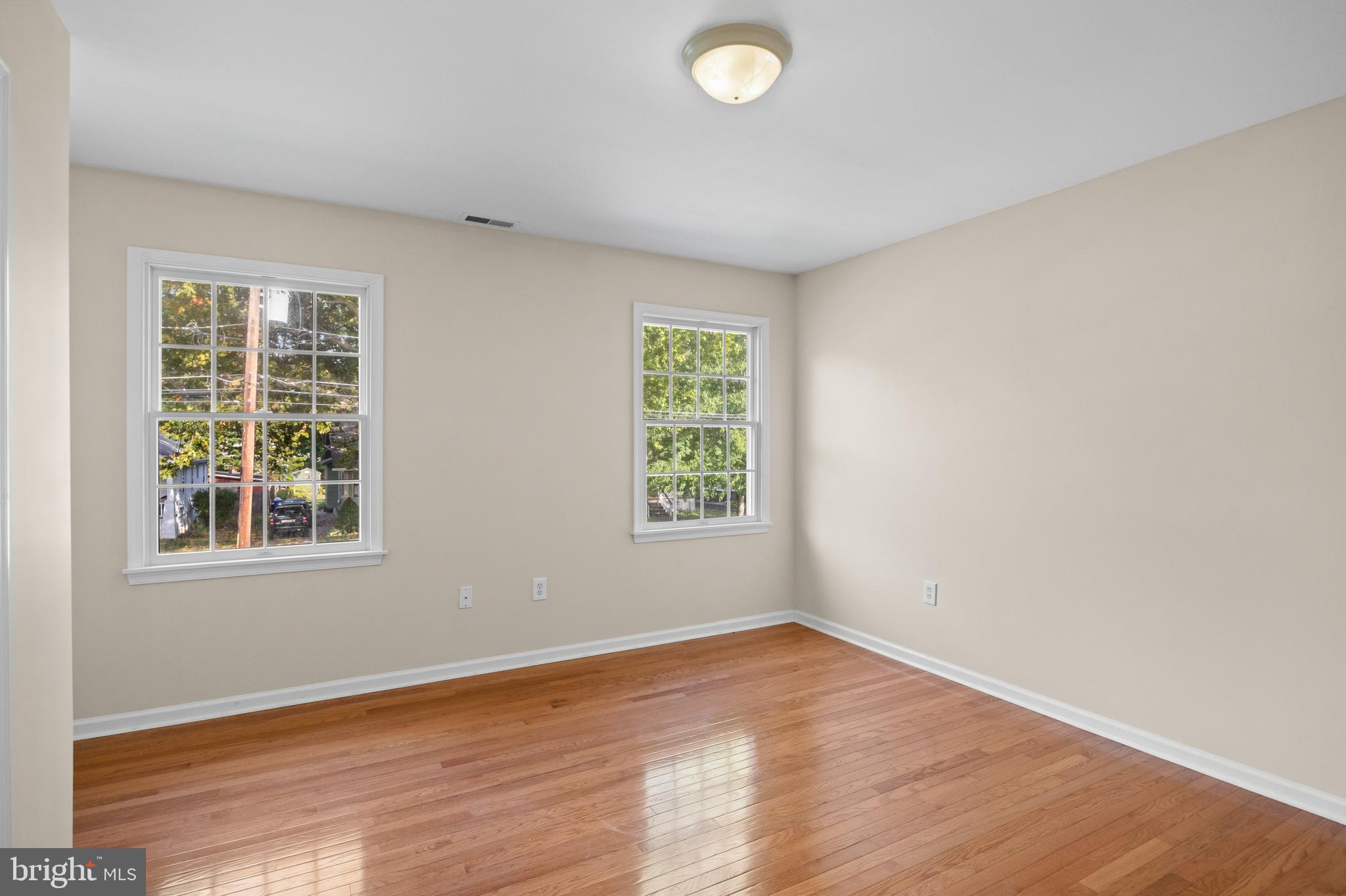 310 South Washington Avenue Moorestown, NJ 08057 - Photo 29 of 37 an empty room with wooden floor and windows