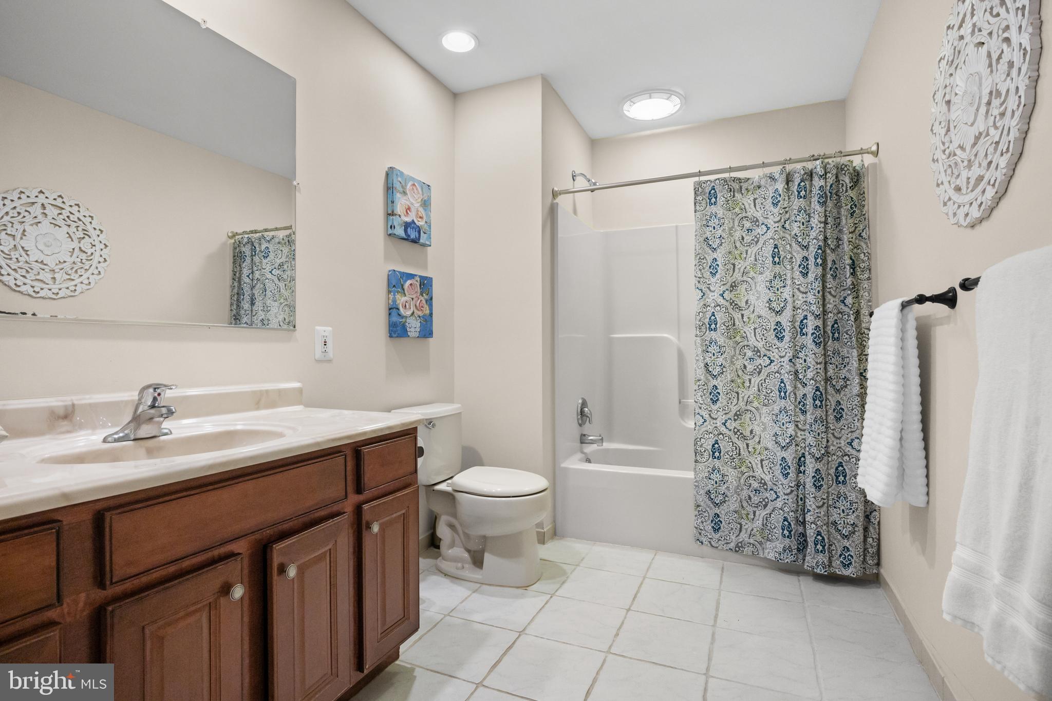 310 South Washington Avenue Moorestown, NJ 08057 - Photo 30 of 37 a bathroom with a granite countertop sink a toilet and a shower