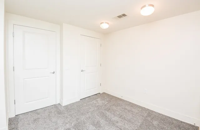 a view of room with flat screen tv