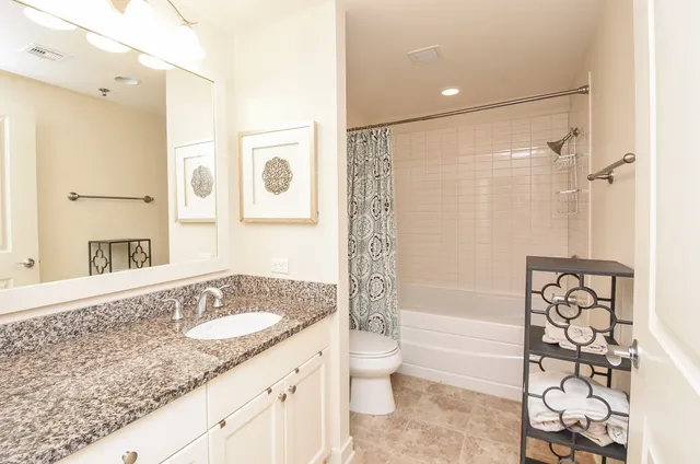 a bathroom with a bathtub and shower curtain