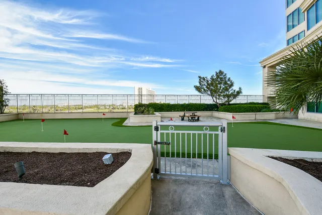 a view of a garden and swimming pool