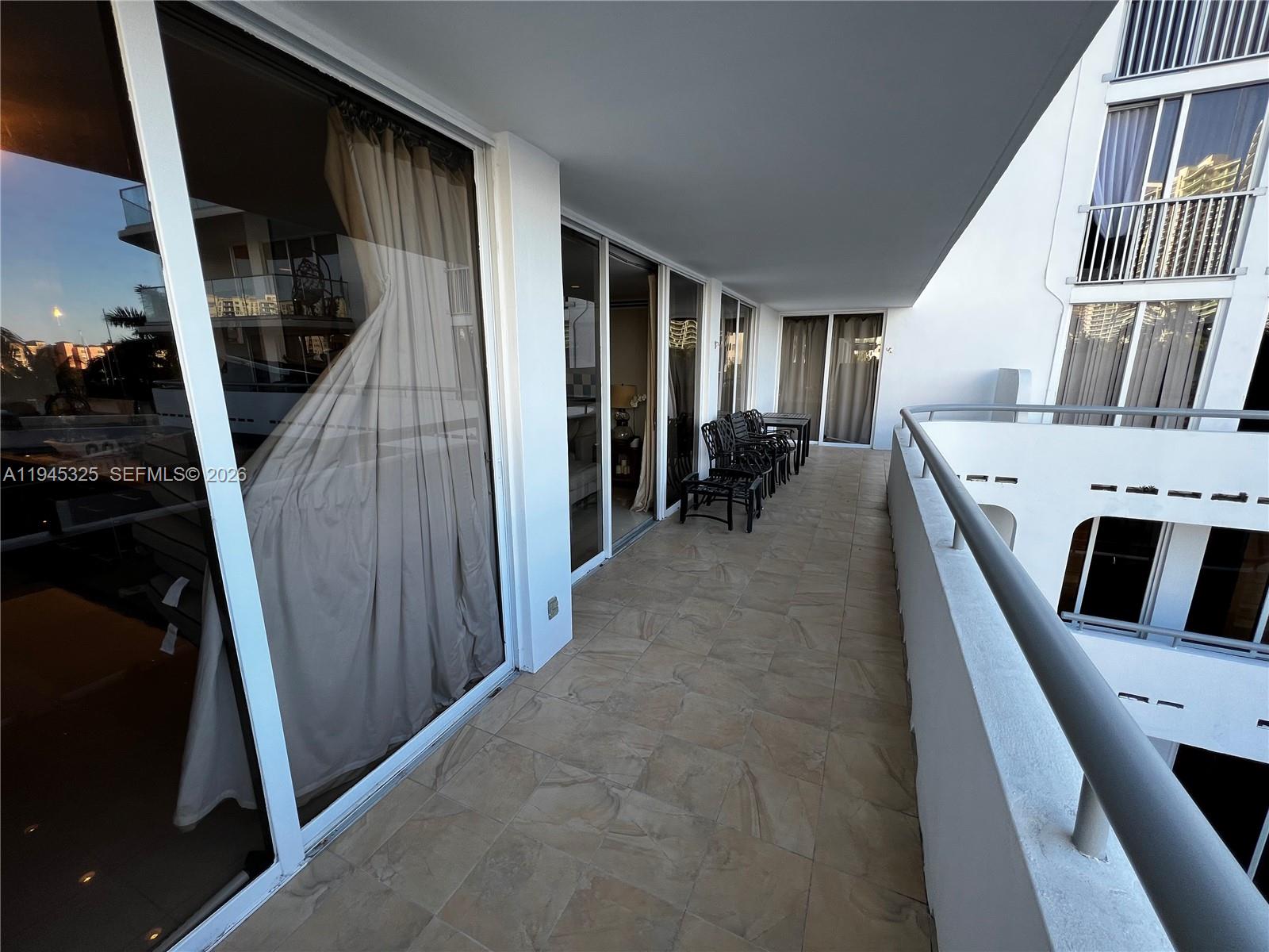 19707 Turnberry Way, Unit 4L Aventura, FL 33180 - Photo 26 of 40 a view of a livingroom with furniture and entryway