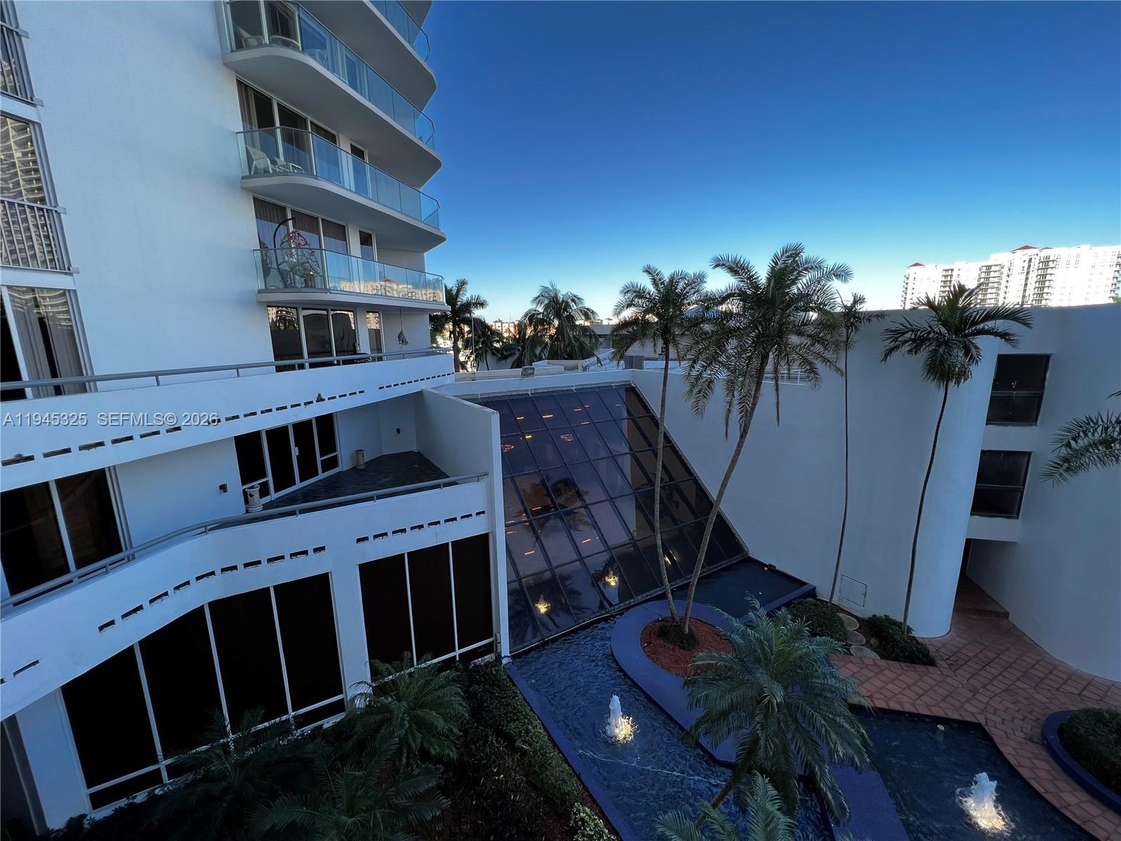 19707 Turnberry Way, Unit 4L Aventura, FL 33180 - Photo 30 of 40 a view of a balcony with plants