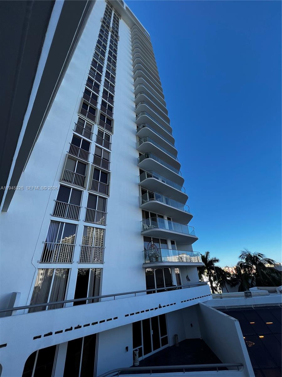 19707 Turnberry Way, Unit 4L Aventura, FL 33180 - Photo 31 of 40 a view of balcony with wooden floor and city view