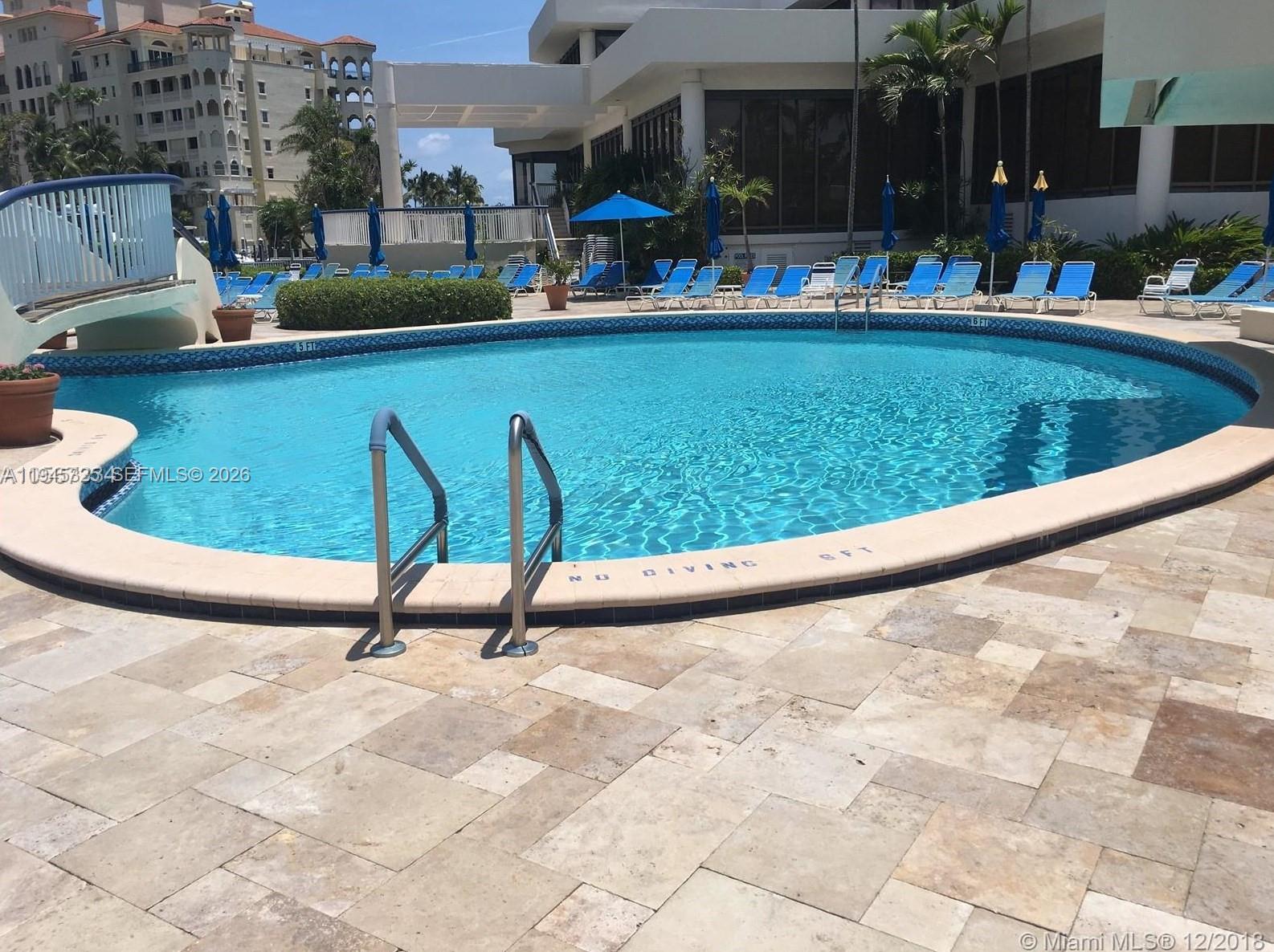 19707 Turnberry Way, Unit 4L Aventura, FL 33180 - Photo 38 of 40 a view of swimming pool with outdoor seating and plants