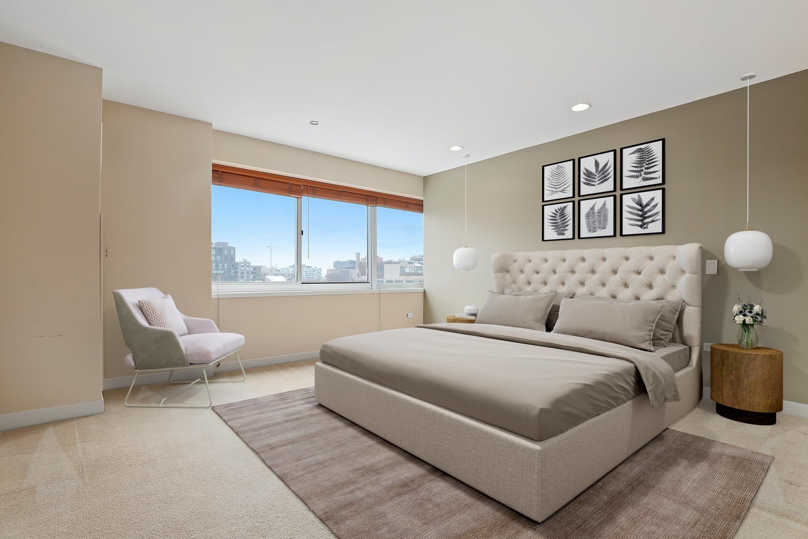 737 West Washington Boulevard, Unit 710 Chicago, IL 60661 - Photo 11 of 28 a bedroom with a large bed and a large window