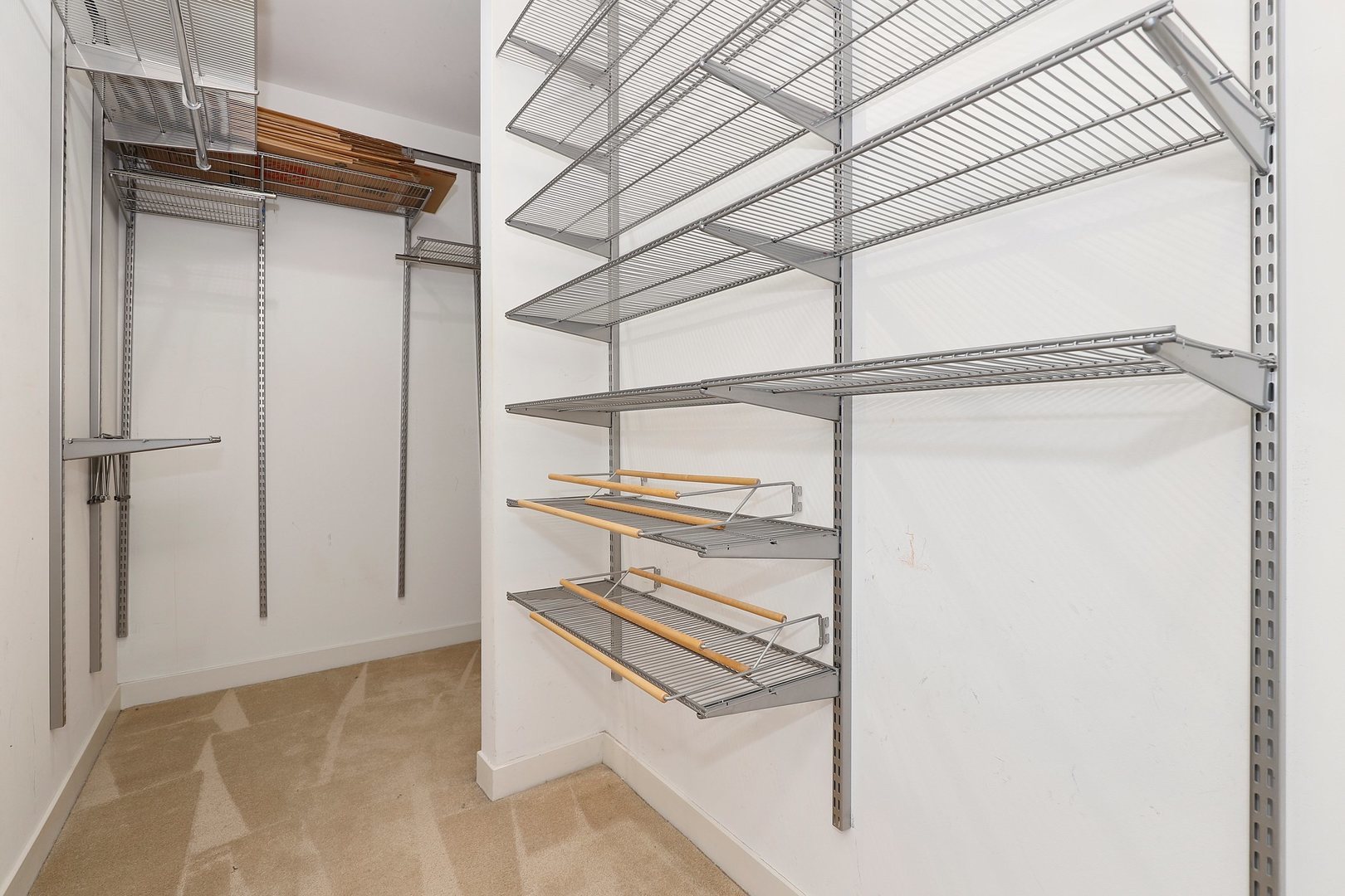 737 West Washington Boulevard, Unit 710 Chicago, IL 60661 - Photo 17 of 28 a view of walk in closet with empty racks