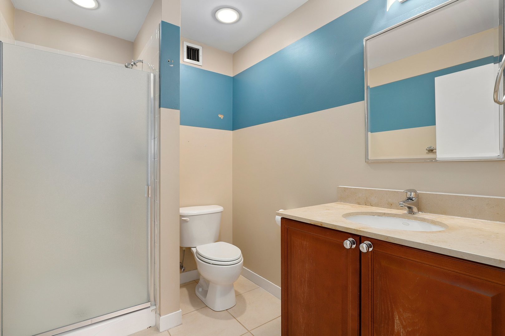 737 West Washington Boulevard, Unit 710 Chicago, IL 60661 - Photo 18 of 28 a bathroom with a sink a toilet and a mirror