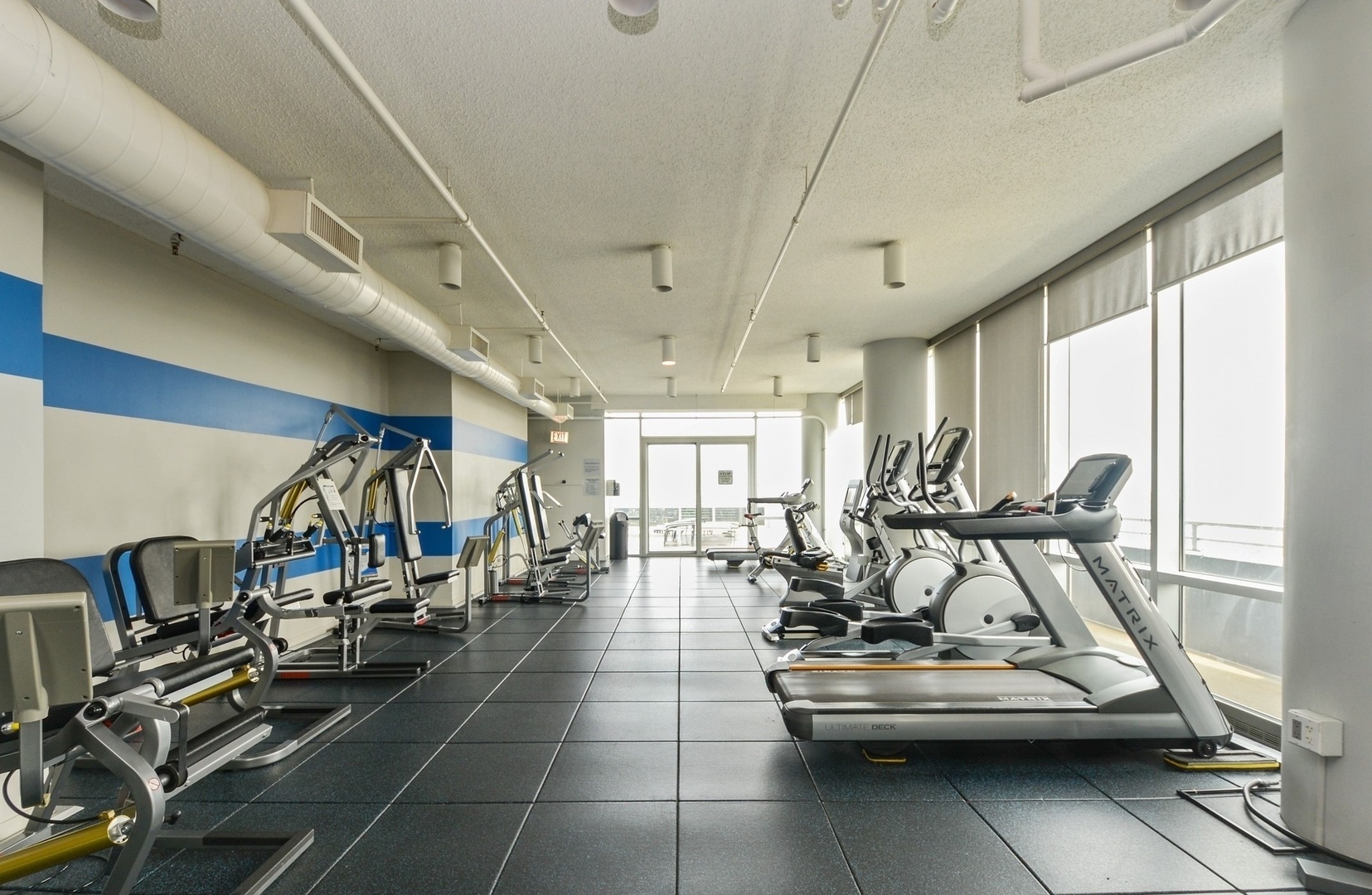 737 West Washington Boulevard, Unit 710 Chicago, IL 60661 - Photo 24 of 28 a view of a room with gym equipment