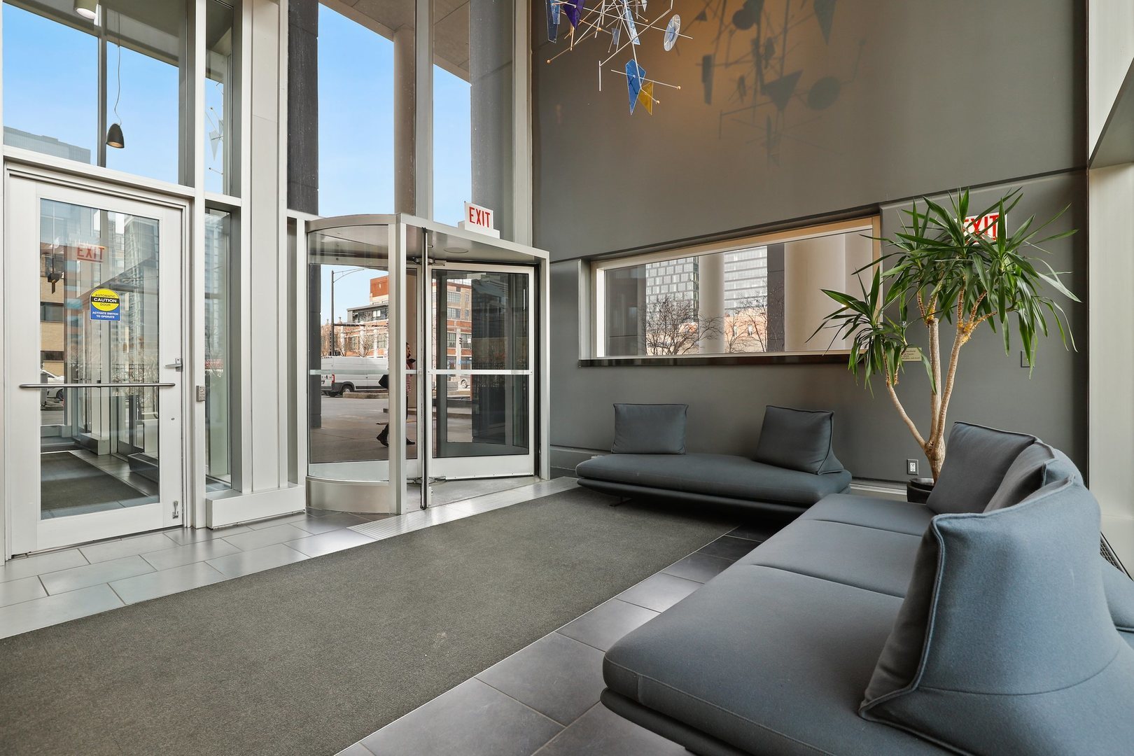 737 West Washington Boulevard, Unit 710 Chicago, IL 60661 - Photo 26 of 28 a living room with furniture and a potted plant