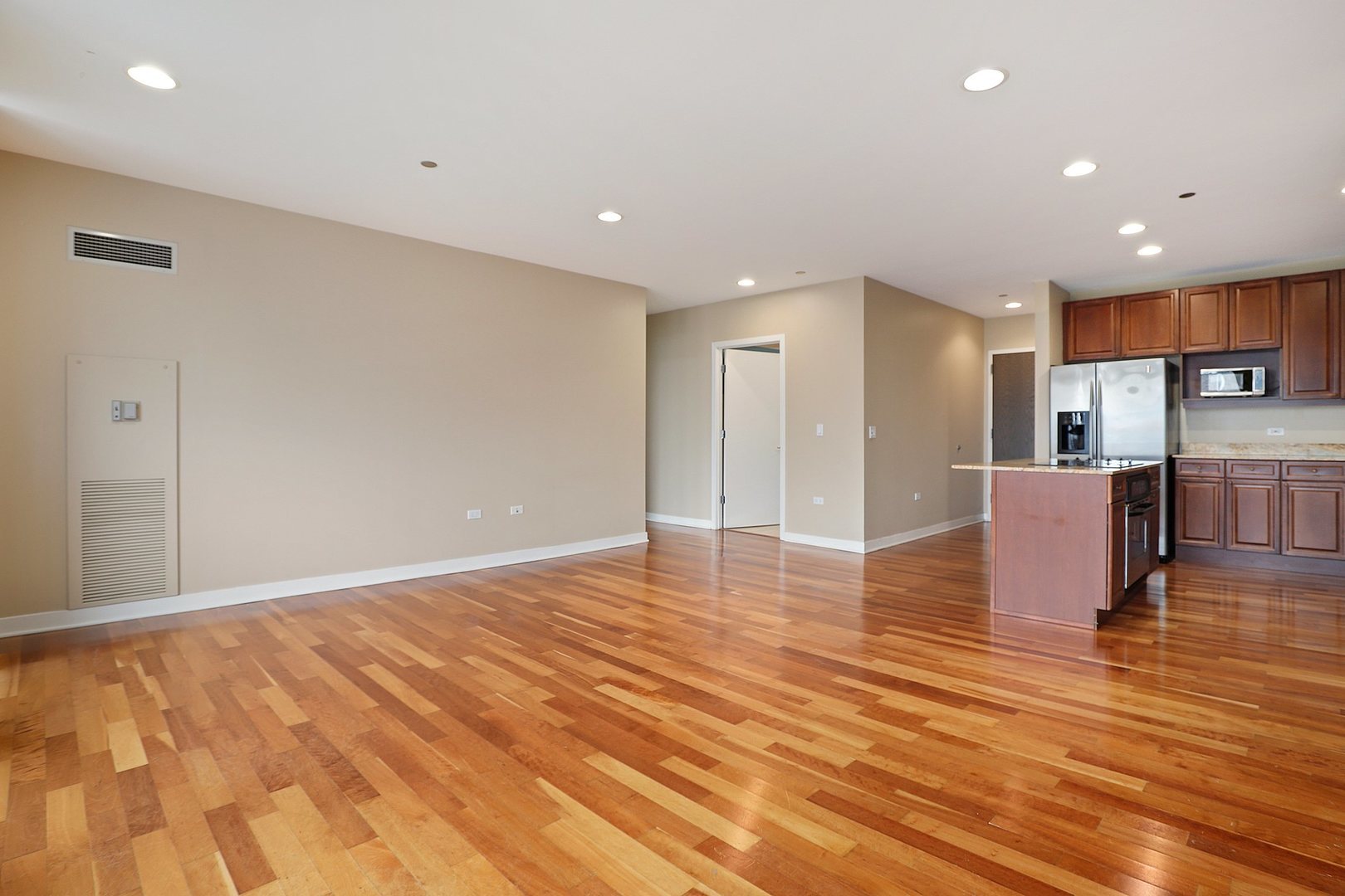 737 West Washington Boulevard, Unit 710 Chicago, IL 60661 - Photo 7 of 28 a view of kitchen with cabinets and wooden floor