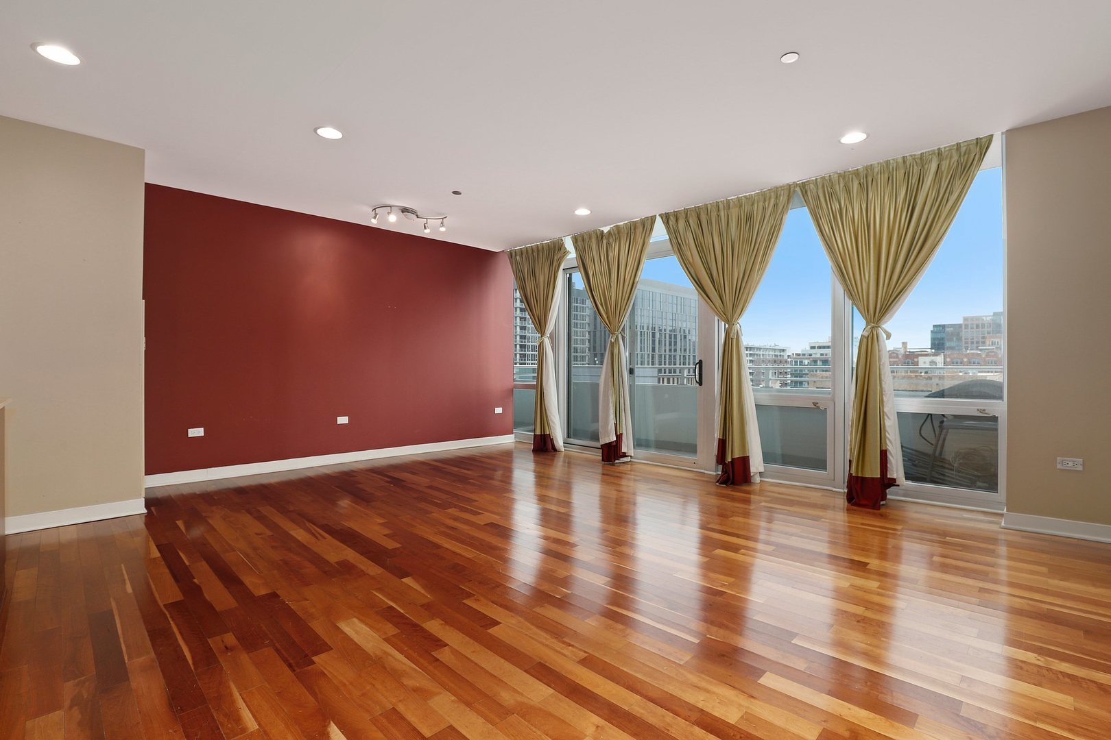 737 West Washington Boulevard, Unit 710 Chicago, IL 60661 - Photo 9 of 28 an empty room with wooden floor and windows