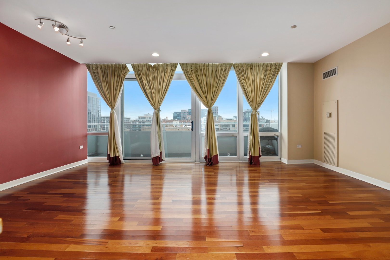 737 West Washington Boulevard, Unit 710 Chicago, IL 60661 - Photo 10 of 28 a view of an empty room with wooden floor and a window