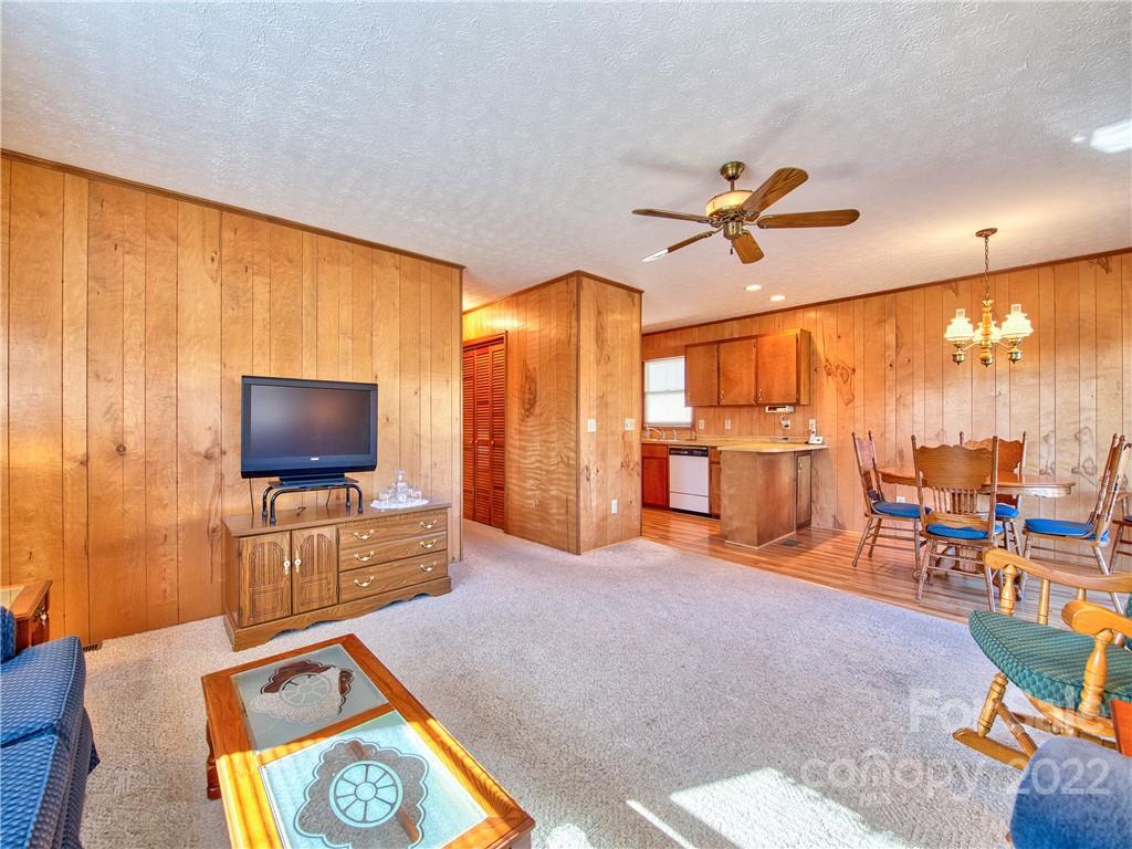 352 Stoney Ridge Loop Maggie Valley, NC 28751 - Photo 13 of 26 a living room with furniture and a flat screen tv