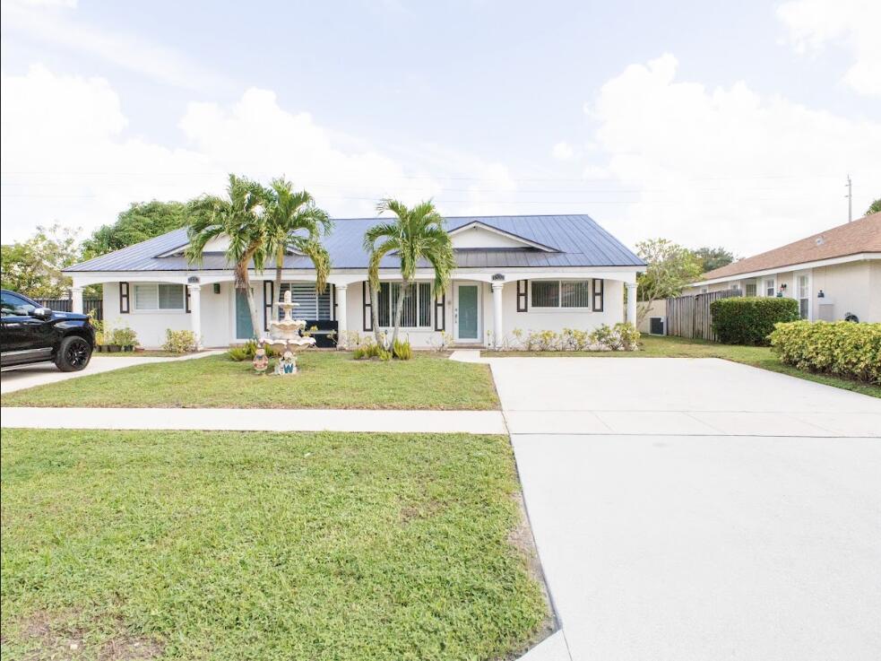 1322 Riverside Circle, Unit 1322 Wellington, FL 33414 - Photo 2 of 20 riverside front