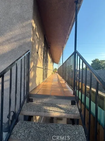 a view of a balcony with wooden floor