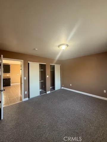 a bathroom with a sink a toilet a mirror and a shower