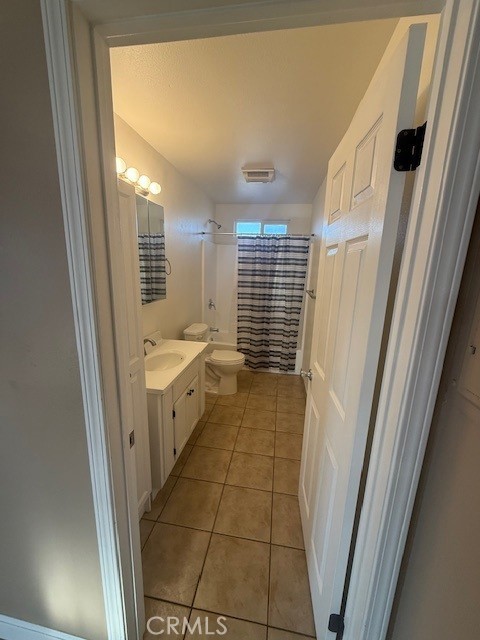 1232 East 68th Street Los Angeles, CA 90001 - Photo 5 of 5 a bathroom with a sink a toilet a mirror and a shower