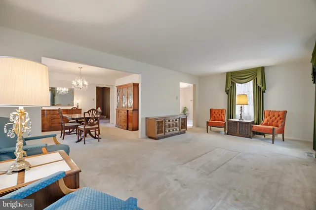 a dining room with furniture and window