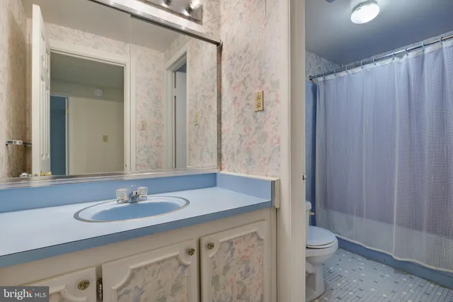 a view of an empty room and a window