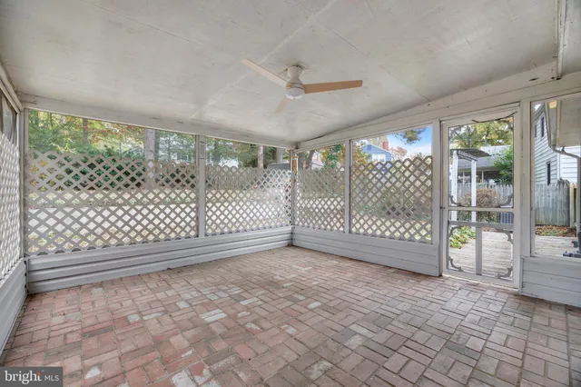 a view of a lake with large trees