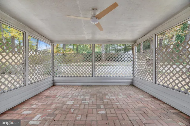 a backyard of a house with a large tree