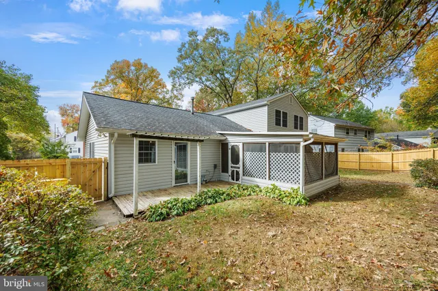 a house that has a tree in front of it