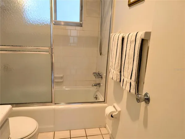 a bathroom with a shower and a toilet