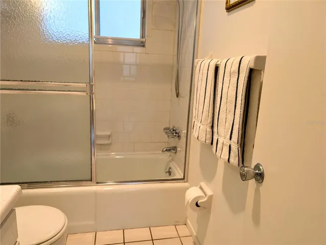 a bathroom with a shower and a toilet