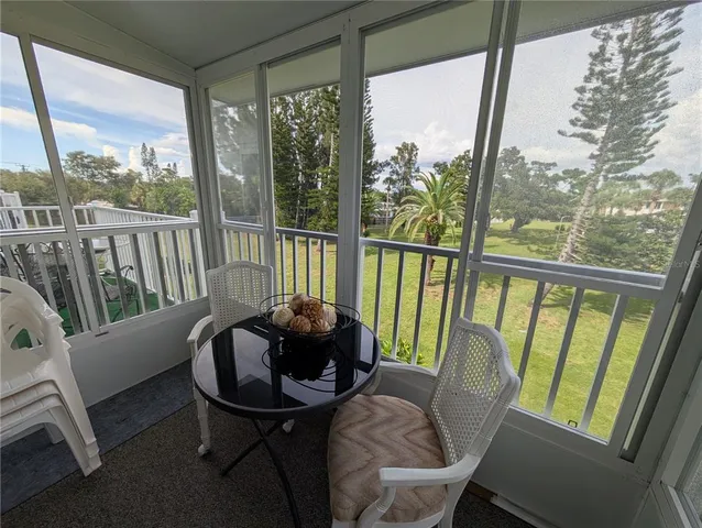 a view of a room with furniture and a window