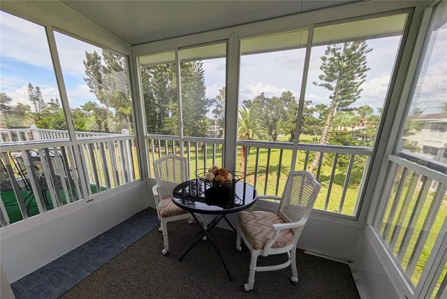 a room with wooden floor and outdoor view