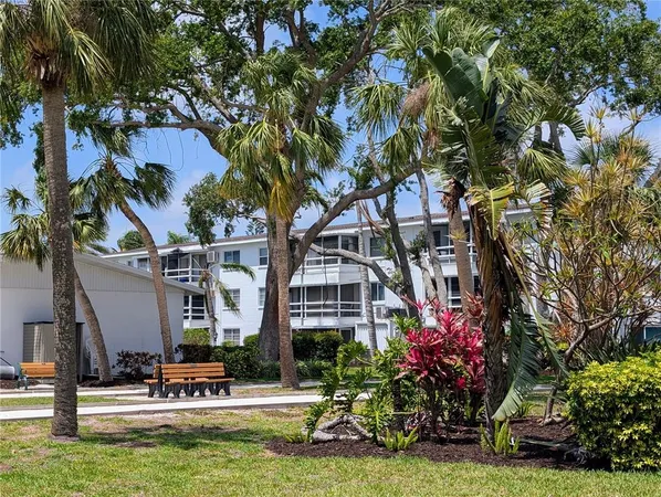 a building view with sitting space and garden view