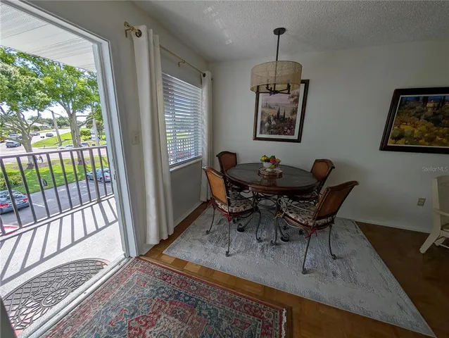 a dining room with furniture and window