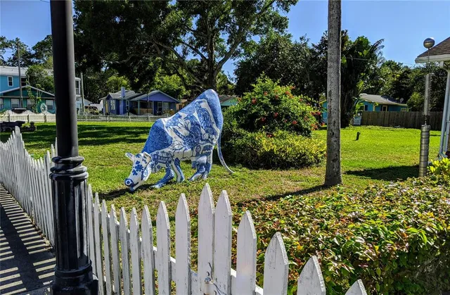 a view of a house with backyard from a balcony