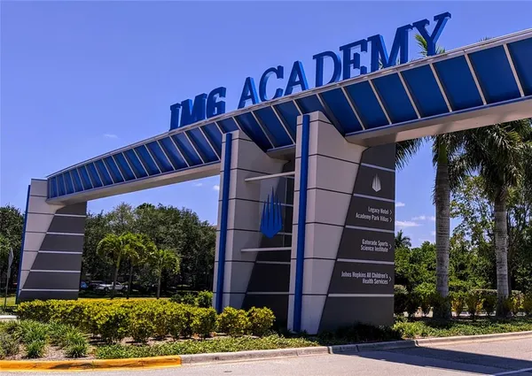 a view of swimming pool with a yard and plants