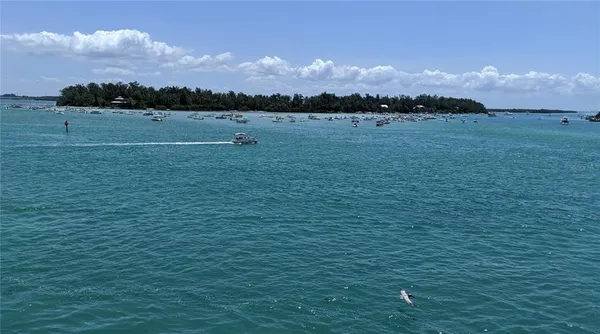 a backyard of a house with barbeque oven table and chairs