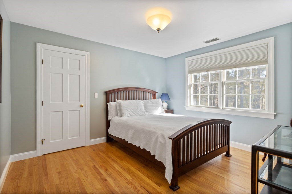 136 Hartwell Road Carlisle, MA 01741 - Photo 31 of 42 a bedroom with a bed and a window