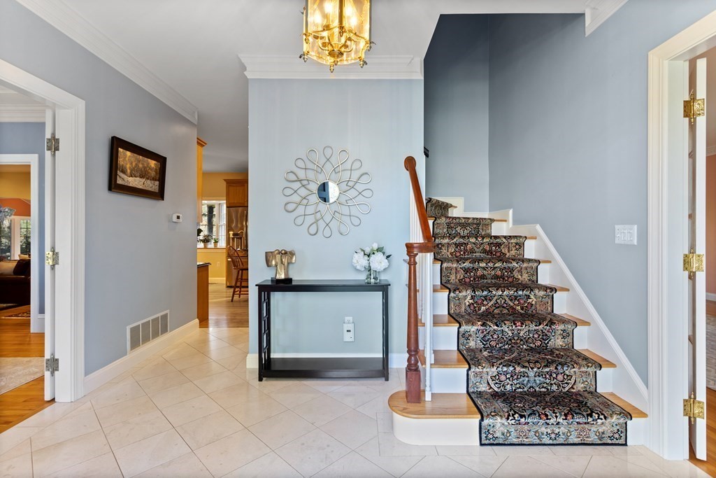 136 Hartwell Road Carlisle, MA 01741 - Photo 4 of 42 a view of a hallway with windows and stairs