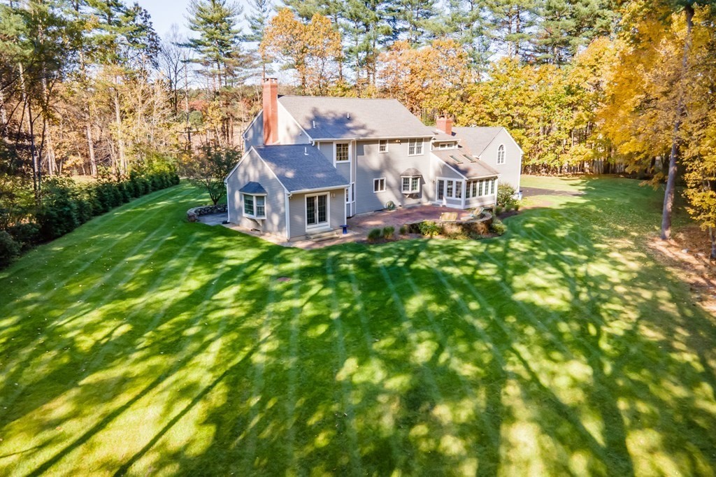 136 Hartwell Road Carlisle, MA 01741 - Photo 42 of 42 a front view of a house with a garden