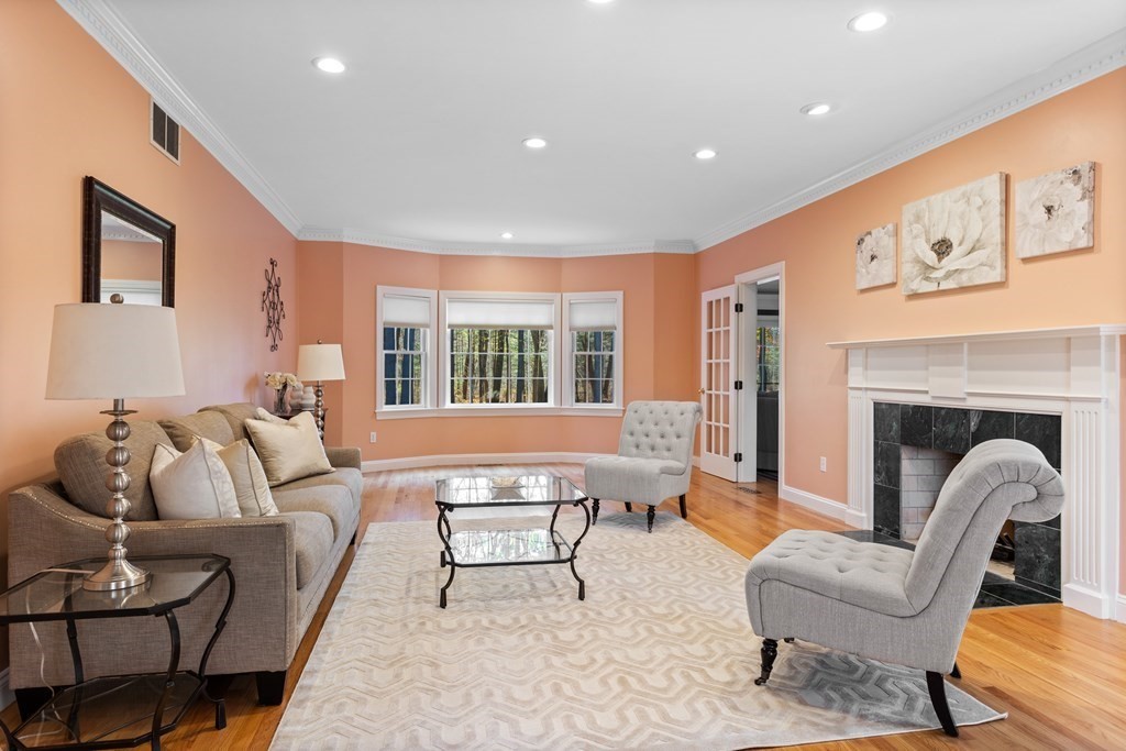 136 Hartwell Road Carlisle, MA 01741 - Photo 6 of 42 a living room with furniture and a fireplace