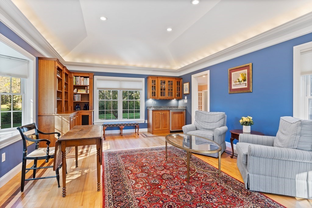 136 Hartwell Road Carlisle, MA 01741 - Photo 8 of 42 a living room with furniture and a floor to ceiling window