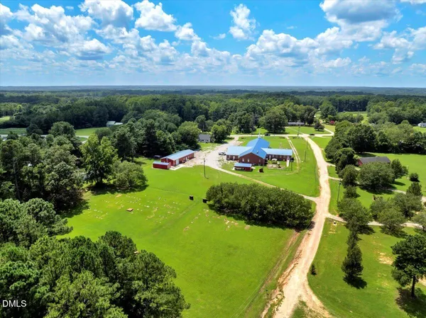 an aerial view of a golf course with parking space
