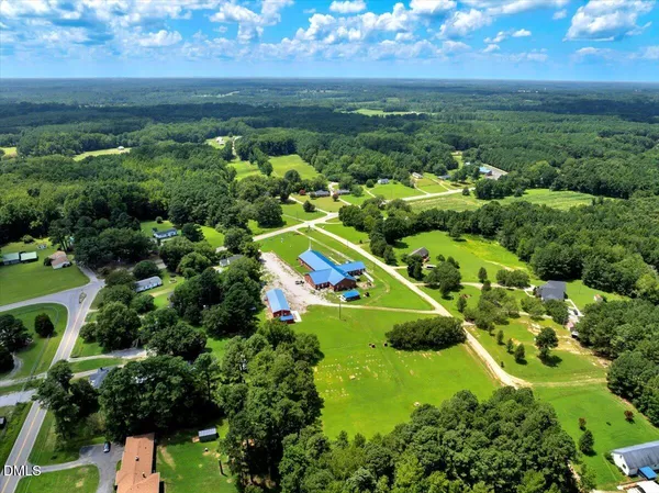a view of a garden with lawn chairs