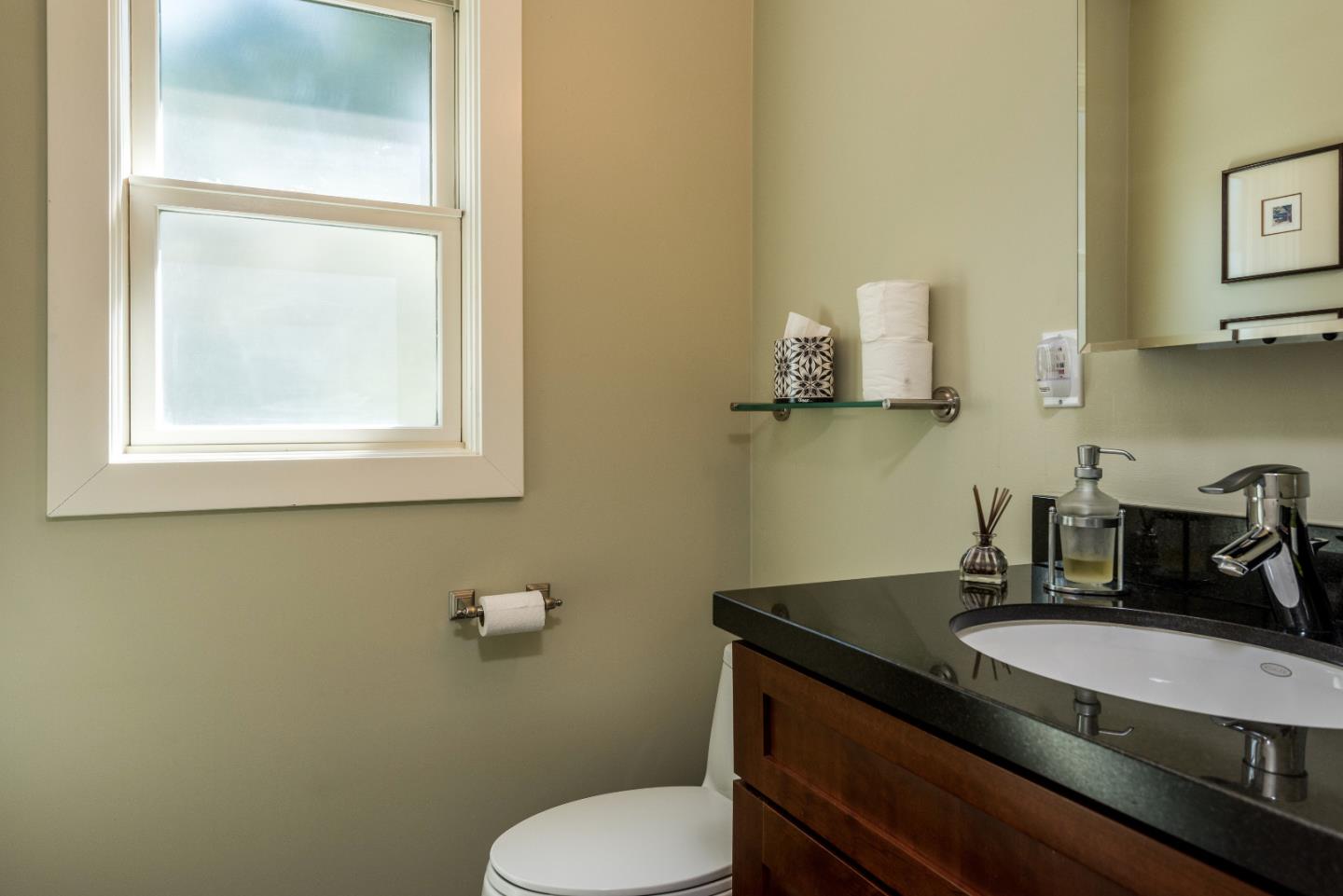 20 Ridgeway Road Hillsborough, CA 94010 - Photo 11 of 31 a bathroom with a granite countertop sink and a toilet