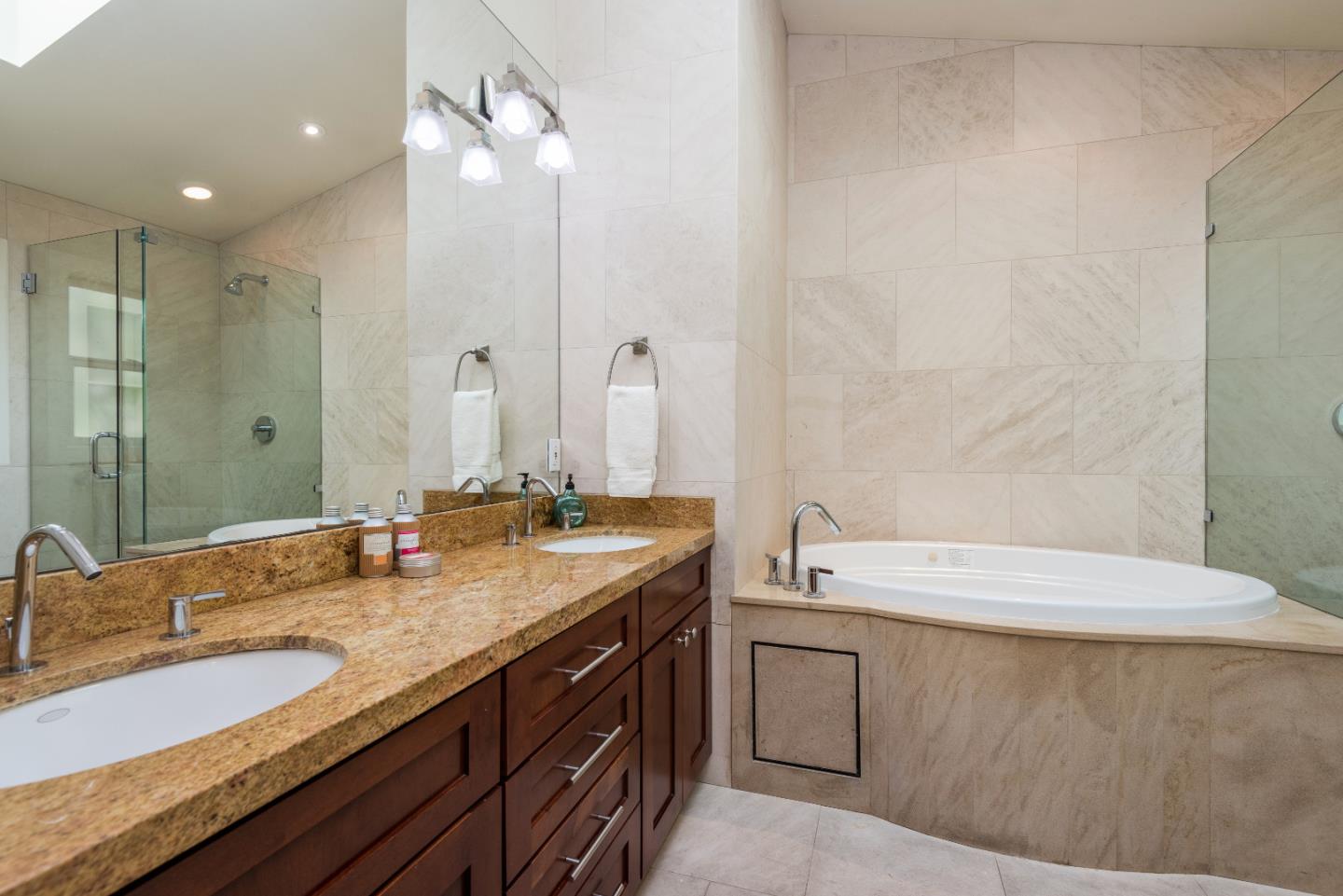 20 Ridgeway Road Hillsborough, CA 94010 - Photo 14 of 31 a bathroom with a granite countertop sink and a mirror