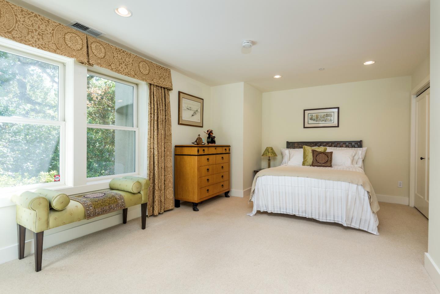 20 Ridgeway Road Hillsborough, CA 94010 - Photo 17 of 31 a bedroom with a bed couch and a large window
