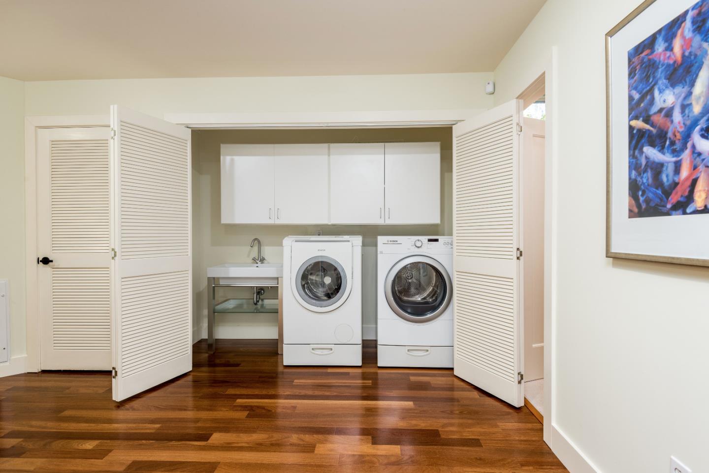 20 Ridgeway Road Hillsborough, CA 94010 - Photo 22 of 31 a view of a hallway with washer and dryer