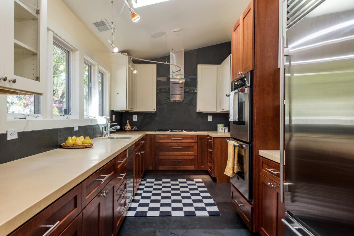 20 Ridgeway Road Hillsborough, CA 94010 - Photo 6 of 31 a kitchen with a sink a stove cabinets and counter space